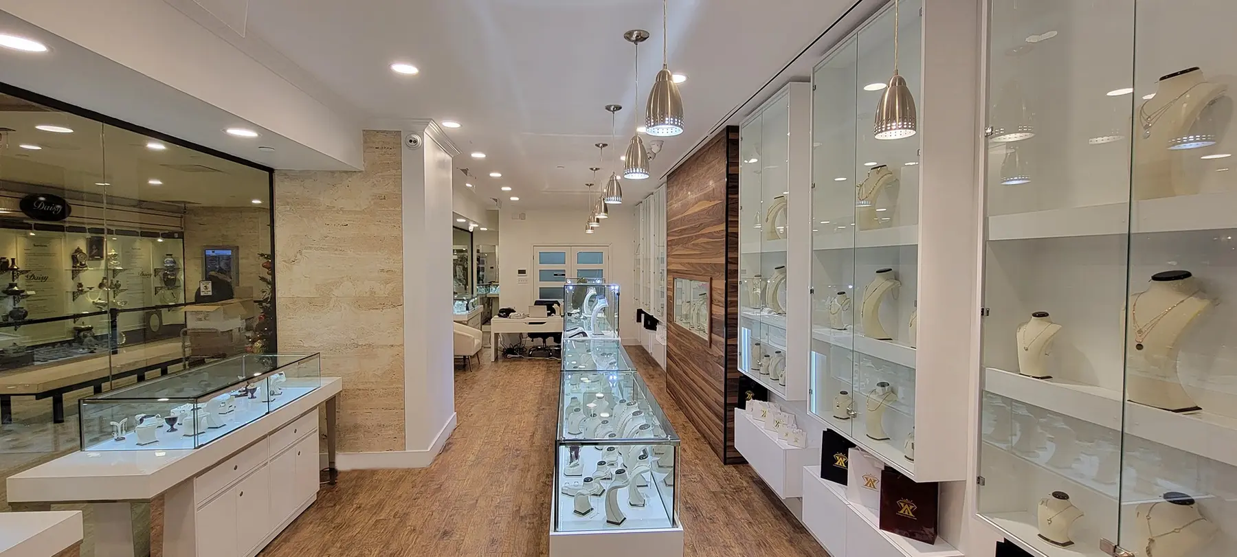Interior of the Yadegari Jewelry showroom in Westmount with illuminated jewelry displays